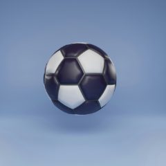 Navy and white football against a blue background