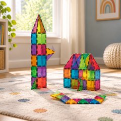 MAGNA-TILES 100-piece set, on a playroom rug in a sunny room