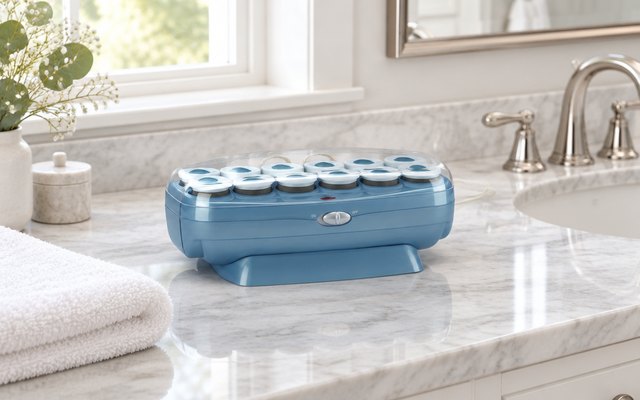 BaBylissPRO Nano Titanium hot rollers, on a marble counter in a bright master bathroom beside a folded white towel