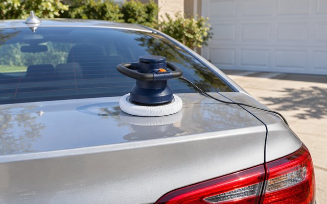 WEN 10PMC waxer/polisher, resting on the trunk of a silver sedan in a sunny driveway