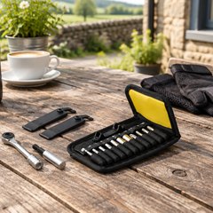 Topeak Ratchet Rocket Lite DX tool kit, open on a picnic table outside a country café