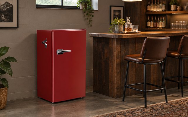 Frigidaire Retro compact fridge, in a basement den beside a small home bar and two bar stools