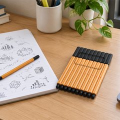 STABILO point 88 fineliners, on a college dorm desk beside a notebook full of doodles