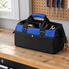 WORKPRO wide-mouth tool bag, open on a garage workbench with a few tools inside