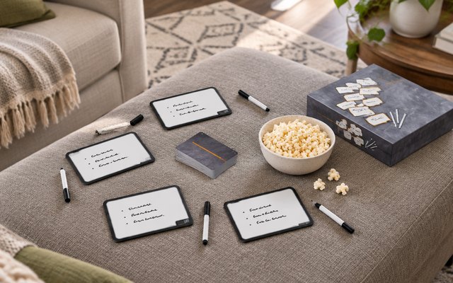 Blank Slate, dry-erase boards and markers on an ottoman