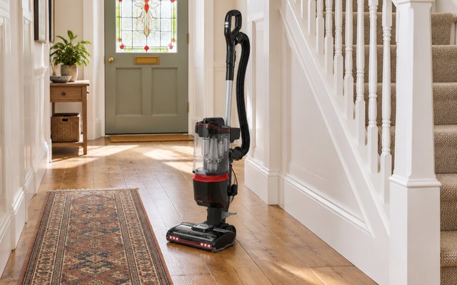 Shark Lift-Away upright vacuum cleaner, standing in a bright hallway
