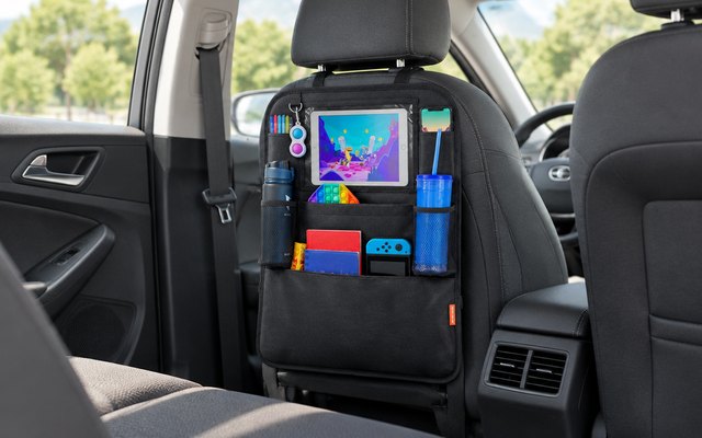 Huckaboo car seat organiser, hung on the back of a car's front seat