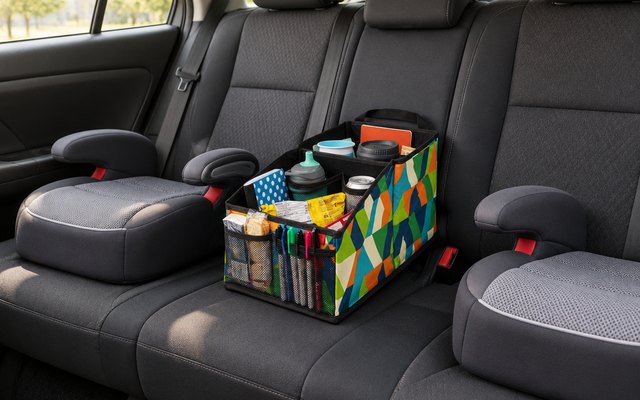 Lusso Gear car seat caddy, between two booster seats on a back seat