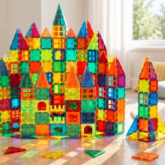 A castle of coloured magnetic tiles on a playroom floor