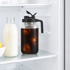 Jrssae 64 oz cold brew mason jar, steeping on a shelf in a bright fridge