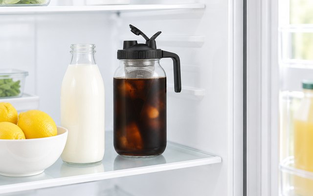 Jrssae 64 oz cold brew mason jar, steeping on a shelf in a bright fridge