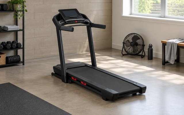 ProForm Carbon TLX treadmill, in a basement home gym with a window, a fan and a towel nearby