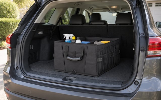 GORILLA GRIP trunk organizer, in the cargo area of an SUV with the hatch open in a driveway