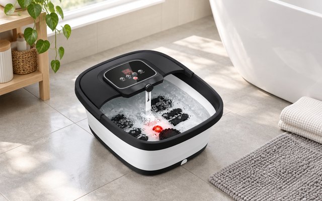 HOSPAN foot spa filled with water on a bright bathroom floor beside a bath mat and towel
