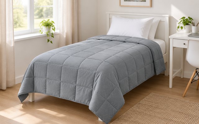 Topblan cooling weighted blanket, on a twin bed in a small, bright bedroom with a white desk