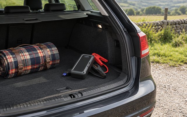 TREKURE 5000A jump starter, in the boot of an estate car in a countryside lay-by