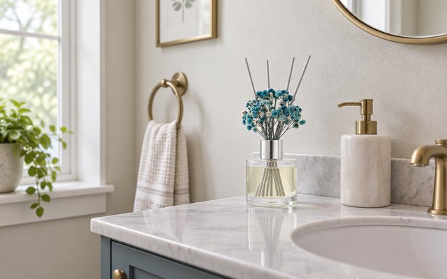 Airkeep Cashmere Vanilla reed diffuser, on the back of a small powder room vanity beside a hand soap