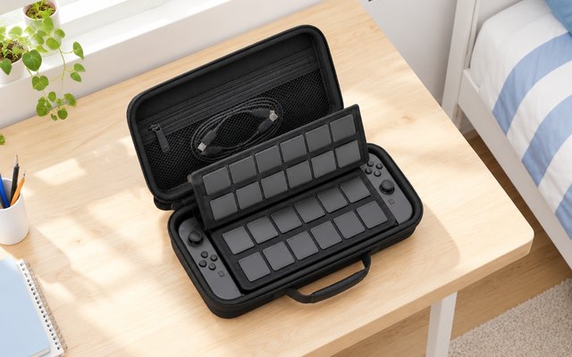 daydayup Switch 2 case open on a sunny desk, its 24 game card slots full